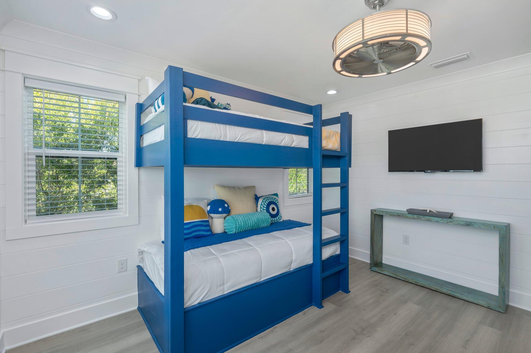 4553 Luke Avenue Destin, FL 32541 - Photo 65 of 70 a bedroom with a bed and a flat screen tv
