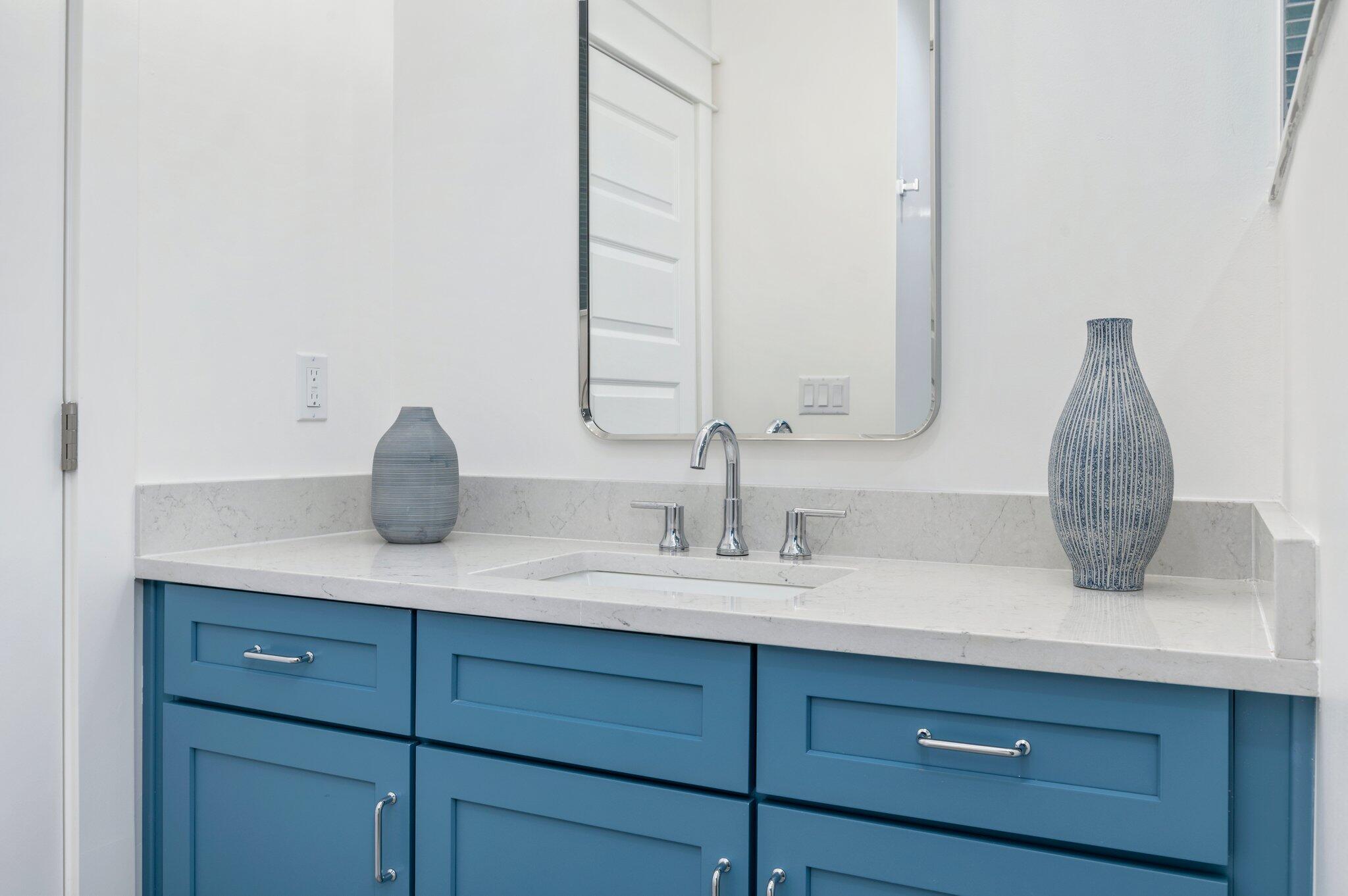 4553 Luke Avenue Destin, FL 32541 - Photo 66 of 70 a bathroom with a sink and a mirror