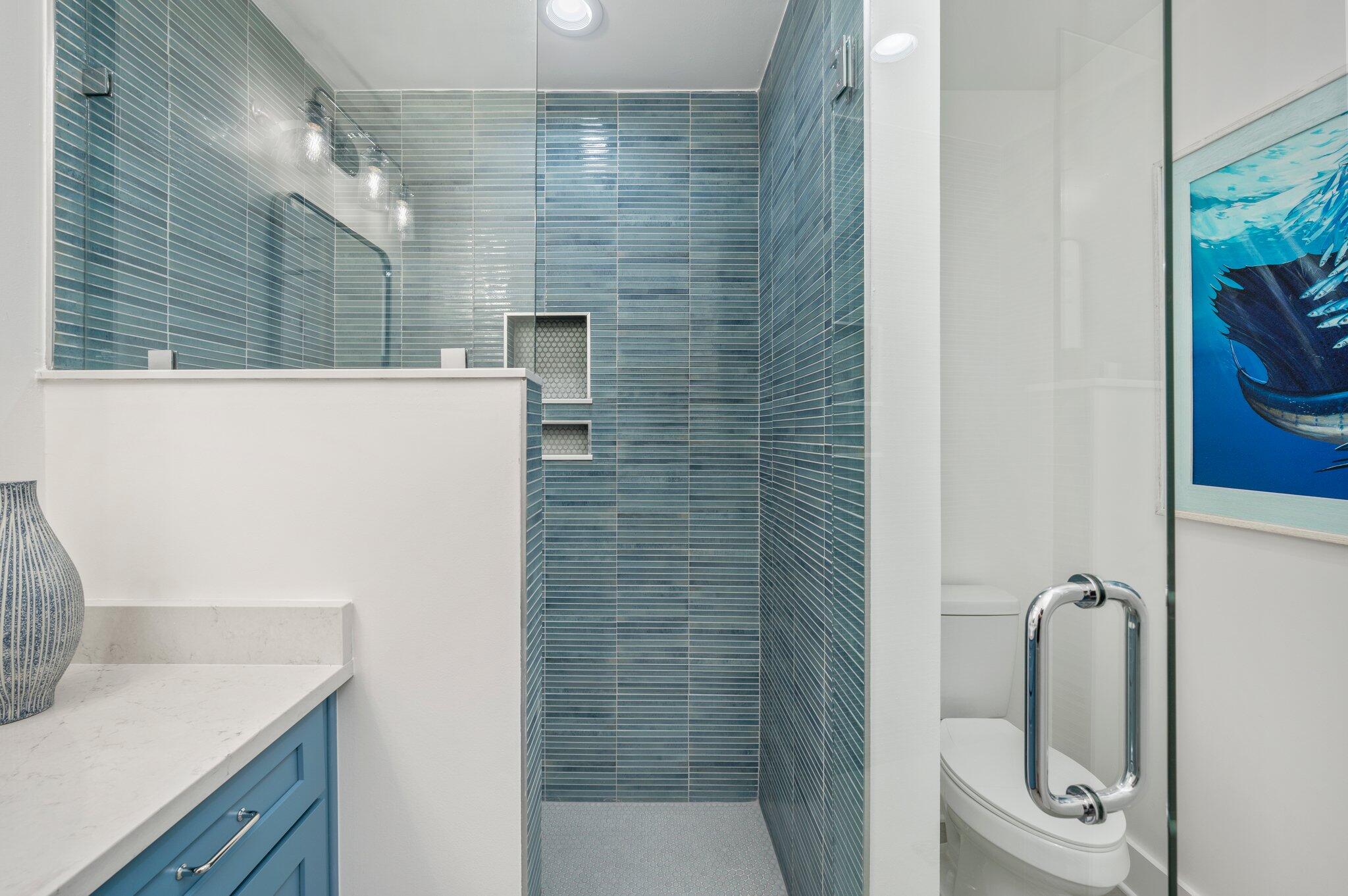 4553 Luke Avenue Destin, FL 32541 - Photo 67 of 70 a bathroom with a granite countertop sink a toilet and shower