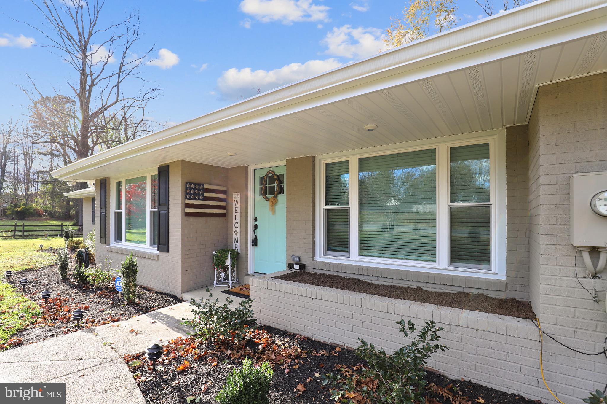9426 Boyds Turn Road Owings, MD 20736 - Photo 2 of 27 a front view of a house with garden