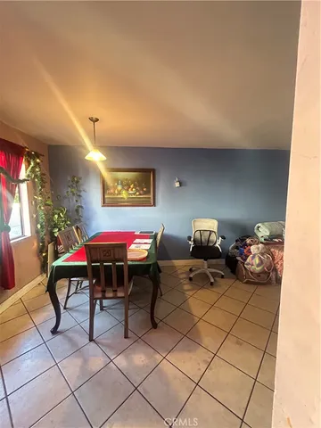 a bedroom with furniture and a fan