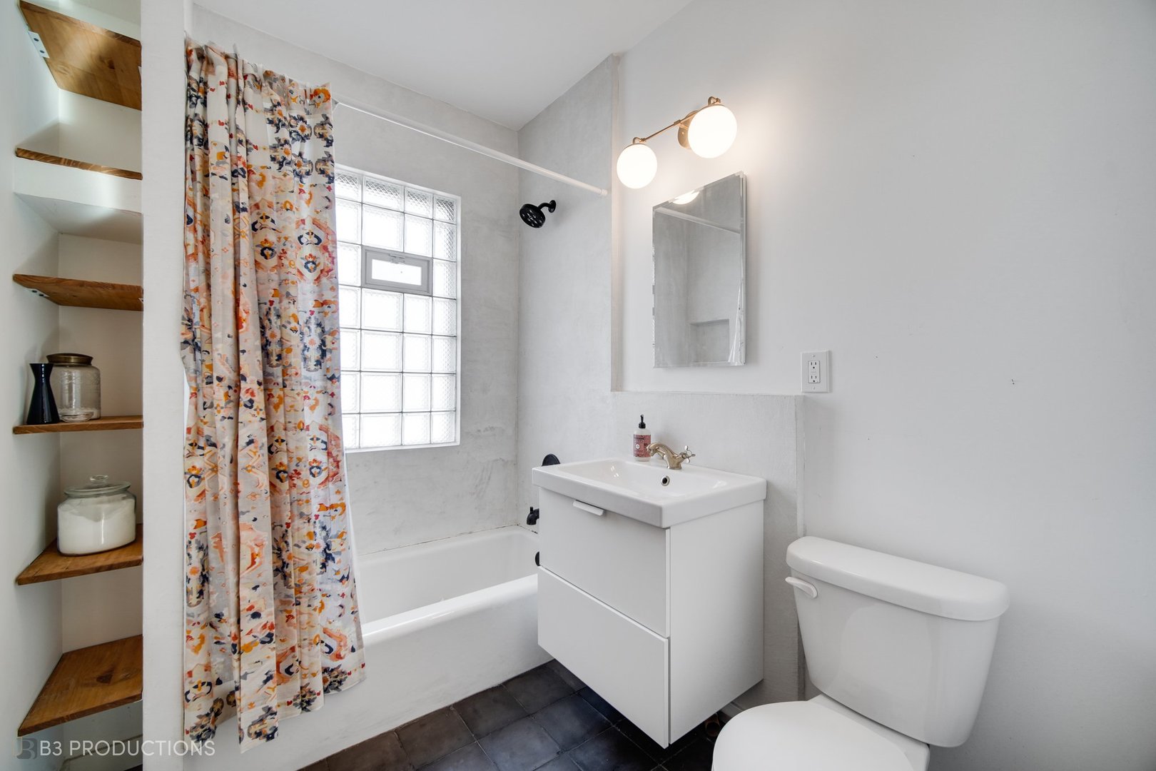 4159 North Maplewood Avenue Chicago, IL 60618 - Photo 17 of 31 a bathroom with a bathtub toilet and sink