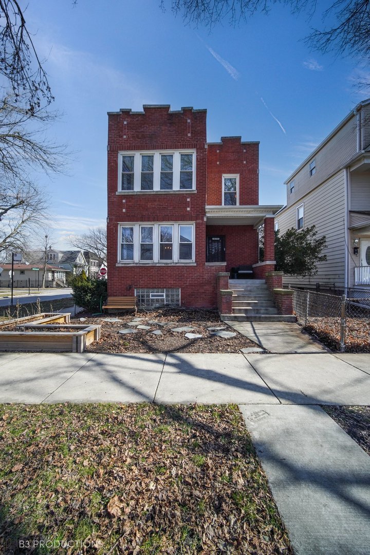 4159 North Maplewood Avenue Chicago, IL 60618 - Photo 2 of 31 a front view of a house with a yard