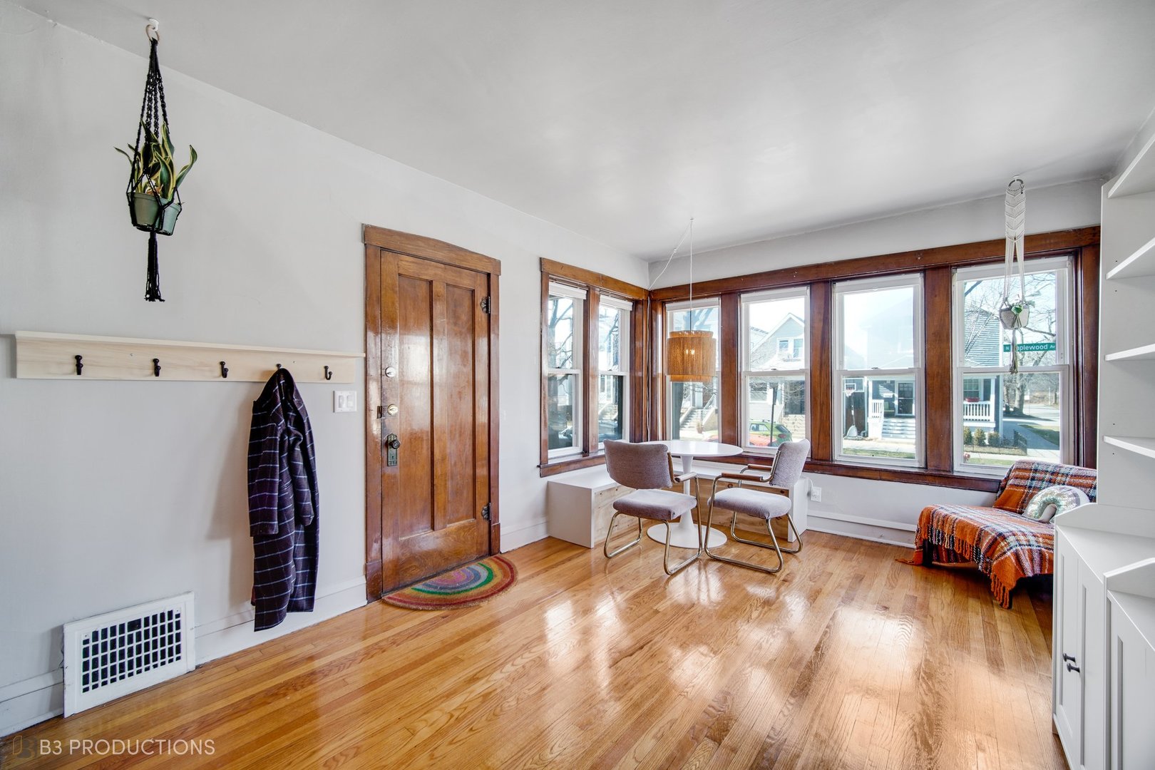 4159 North Maplewood Avenue Chicago, IL 60618 - Photo 3 of 31 a living room with furniture and large windows