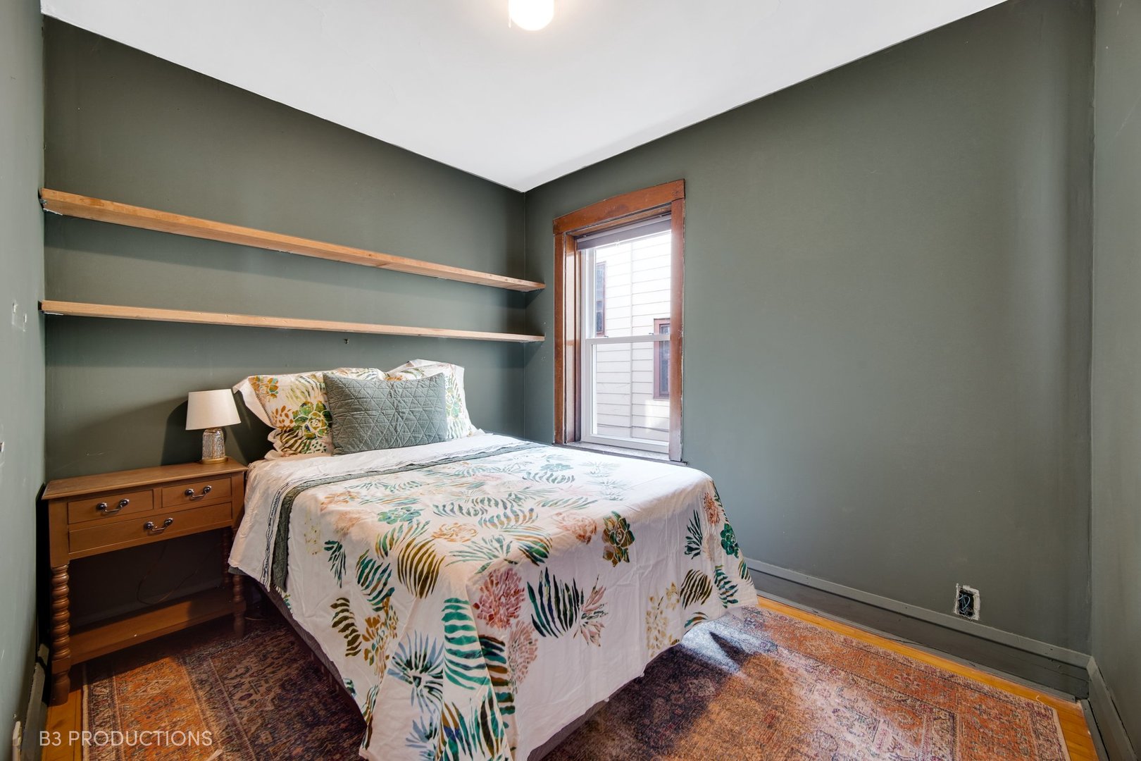 4159 North Maplewood Avenue Chicago, IL 60618 - Photo 7 of 31 a bedroom with a bed and window