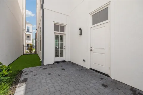 a bathroom with a double vanity sink large mirror and a bathtub