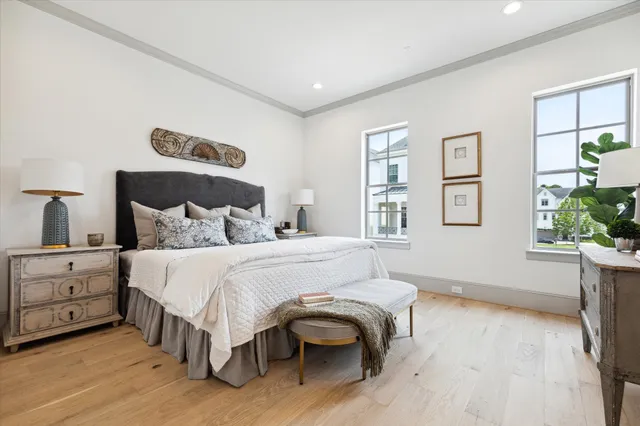 a bedroom with a large bed and a window