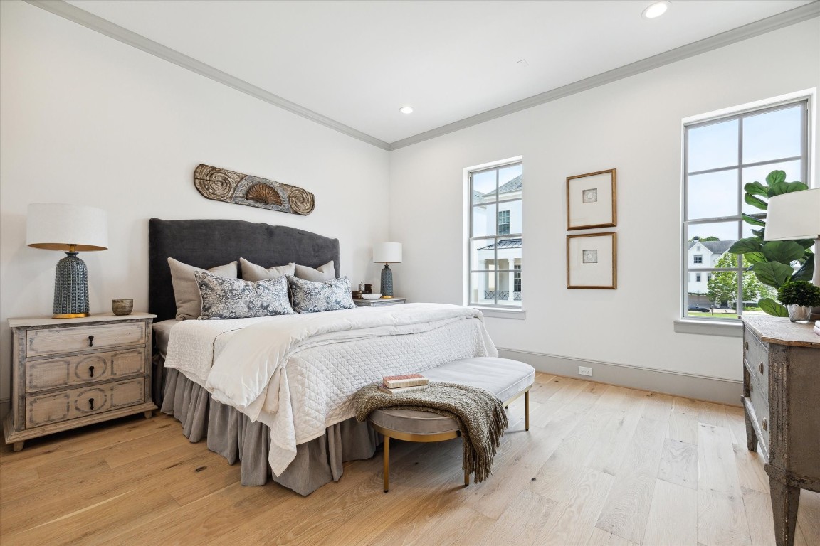 207 Sutton Row Place Houston, TX 77024 - Photo 13 of 30 a bedroom with a bed and a painting on the wall