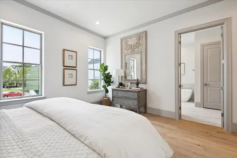 a room with a bed and a cabinets