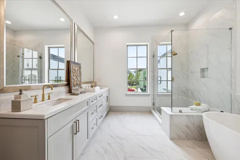 a bathroom with a bathtub and next to a window