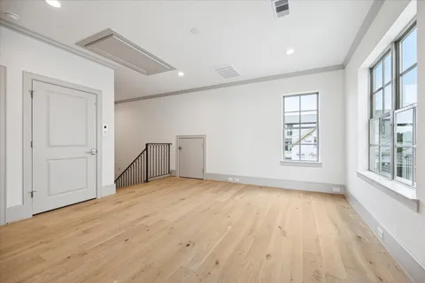 a view of a balcony with wooden floor