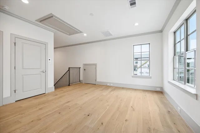 a view of a balcony with wooden floor