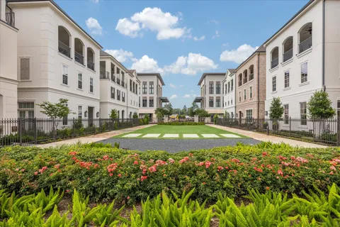 a picture of a room with a white wall and a painting