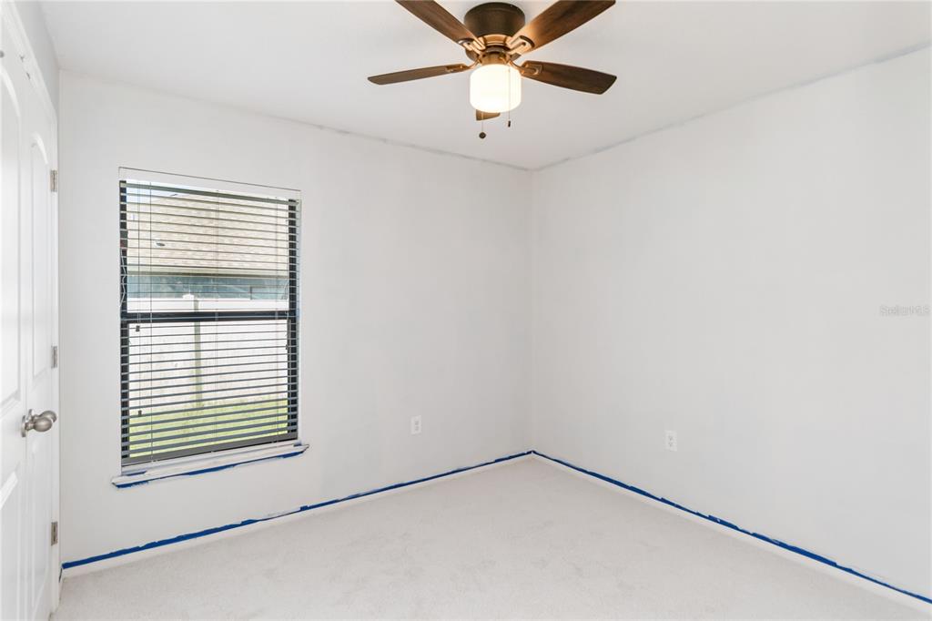 559 Siesta Key Avenue Tavares, FL 32778 - Photo 16 of 24 a view of an empty room with a window