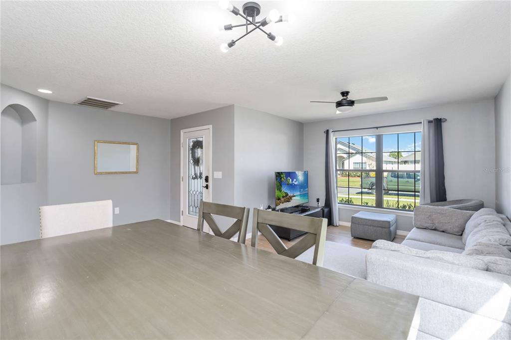 559 Siesta Key Avenue Tavares, FL 32778 - Photo 4 of 24 a living room with furniture and a window