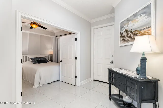 a spacious bathroom with a granite countertop double vanity sink a mirror and a bathtub