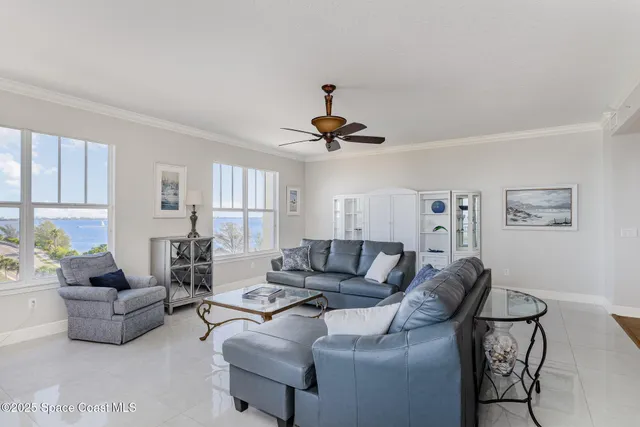 a open kitchen with stainless steel appliances granite countertop a stove a sink dishwasher a dining table and chairs with wooden floor