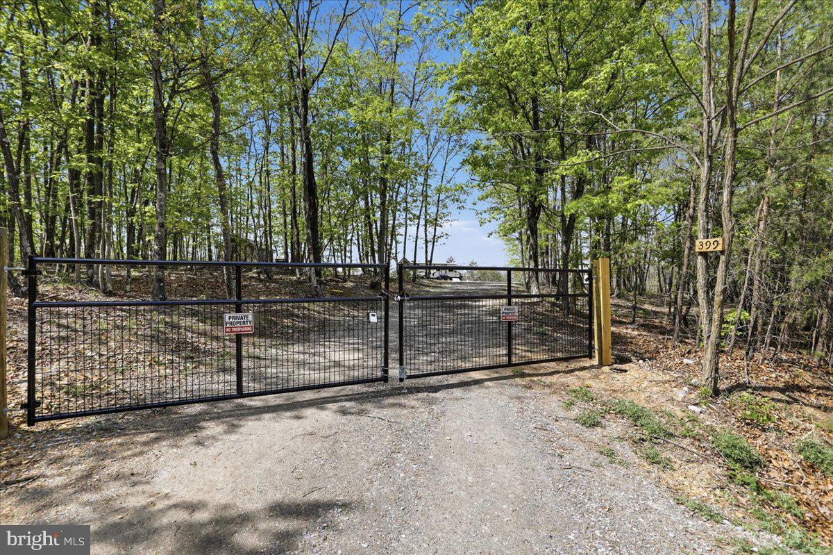 399 Buttonwood Trail Romney, WV 26757 - Photo 18 of 29 a view of backyard with wooden fence