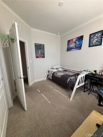 a bedroom with a bed and a table in it