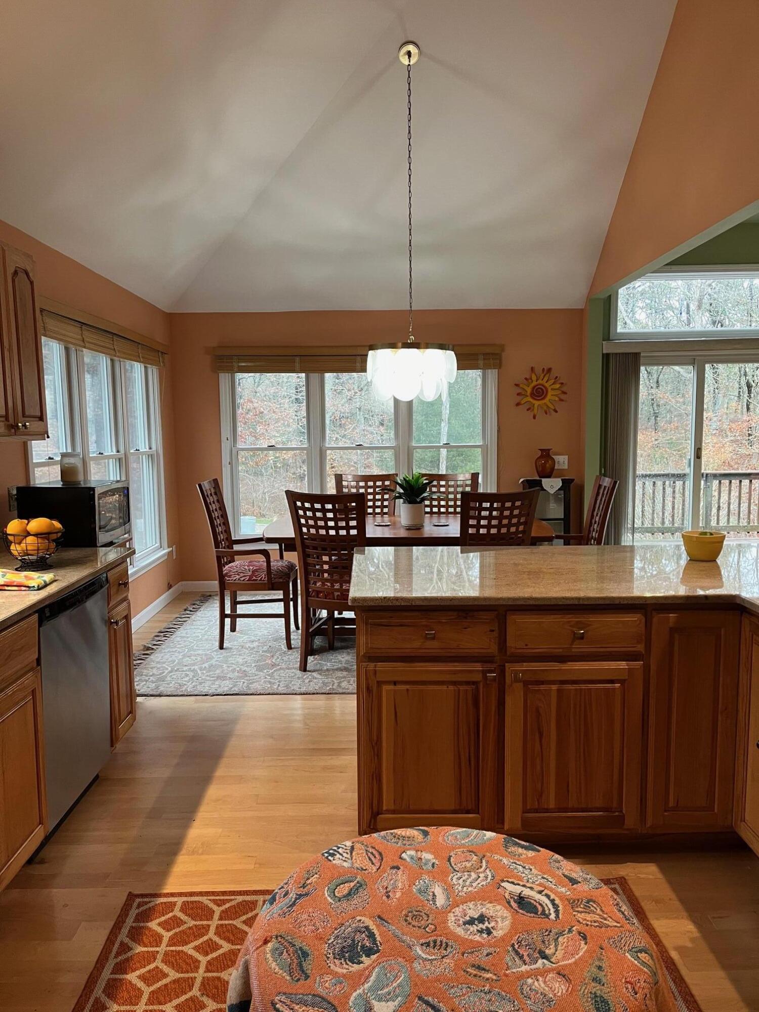 45 John Myrick Circle Brewster, MA 02631 - Photo 14 of 32 a kitchen with a table and chairs in it