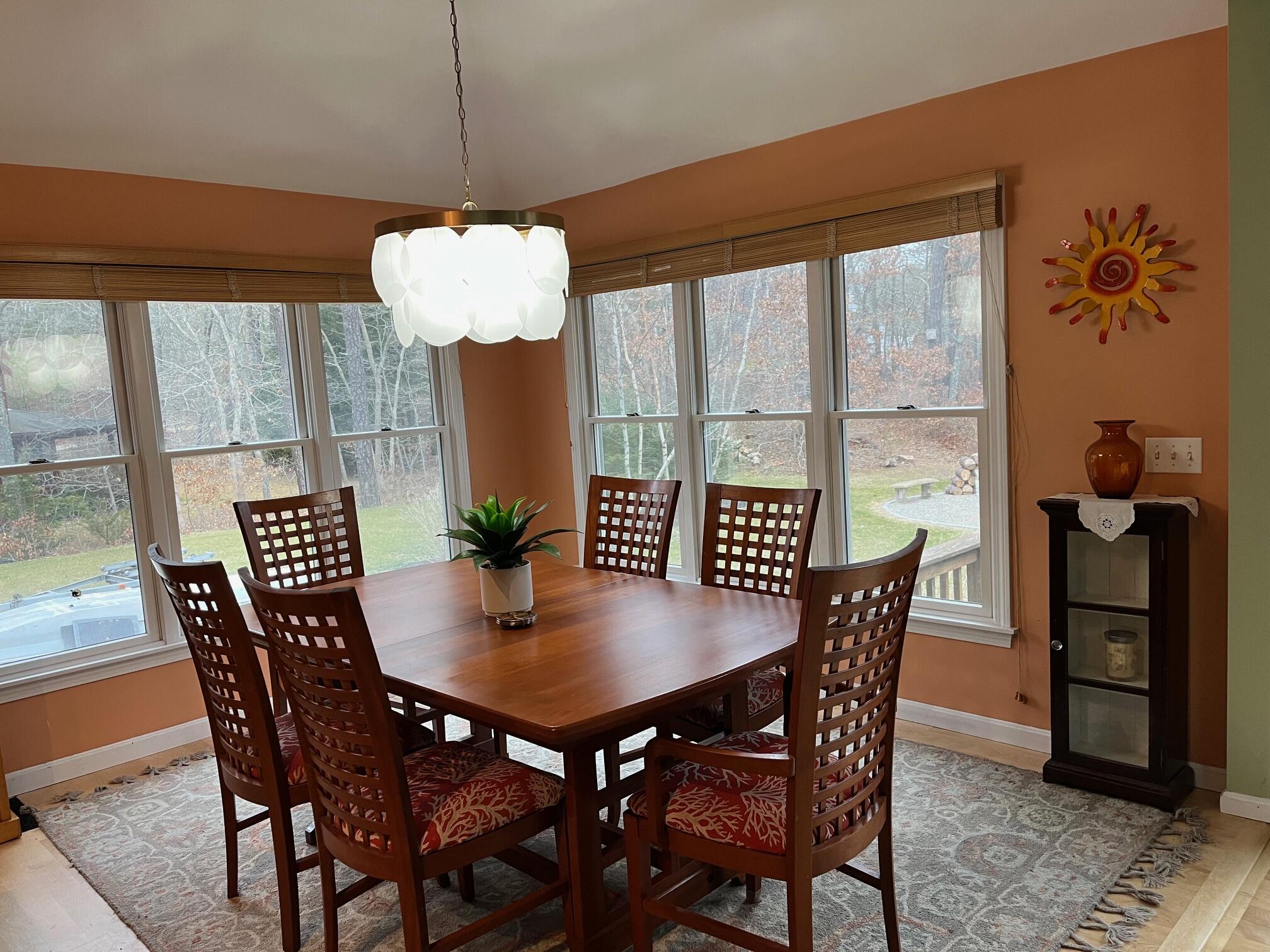 45 John Myrick Circle Brewster, MA 02631 - Photo 15 of 32 a view of a dining room with furniture and wooden floor