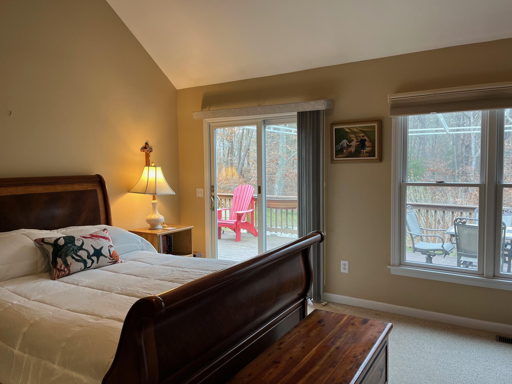 45 John Myrick Circle Brewster, MA 02631 - Photo 20 of 32 a bedroom with a bed and wooden floor