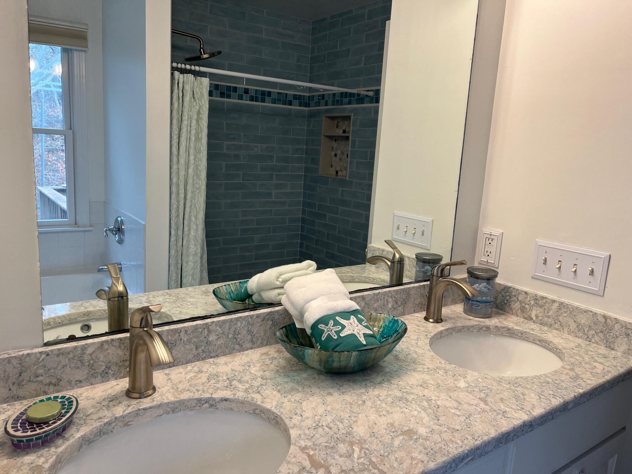 45 John Myrick Circle Brewster, MA 02631 - Photo 21 of 32 a bathroom with a granite countertop sink and a mirror
