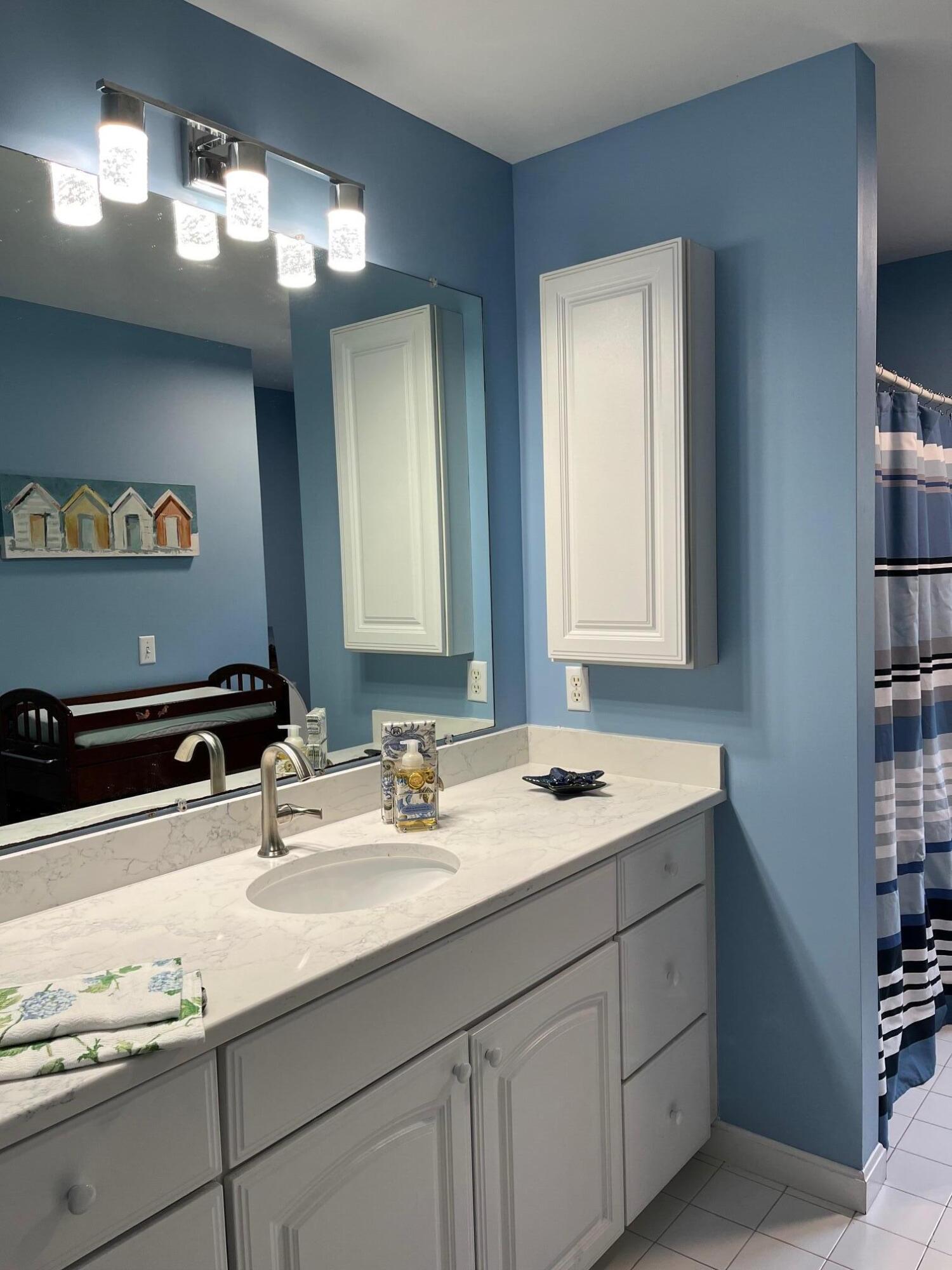 45 John Myrick Circle Brewster, MA 02631 - Photo 23 of 32 a bathroom with a sink and a mirror