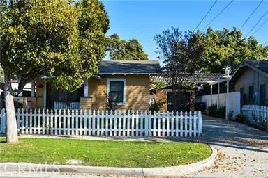 a view of a house with a small yard