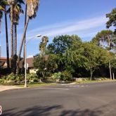 a view of a street with a building in the background