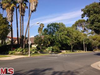 a view of a street with a building in the background