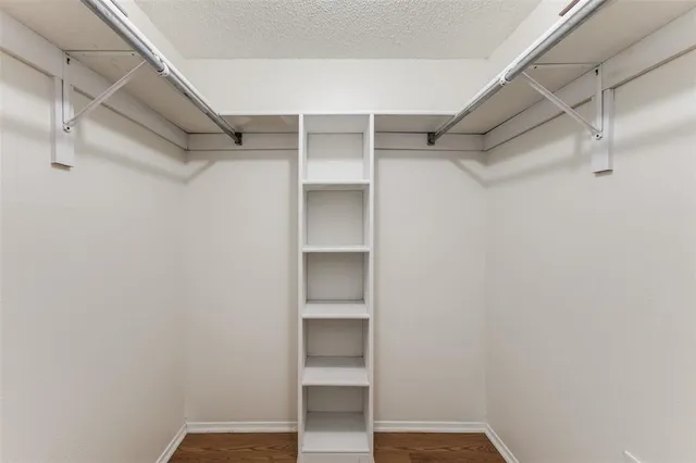 a view of an empty walk in closet