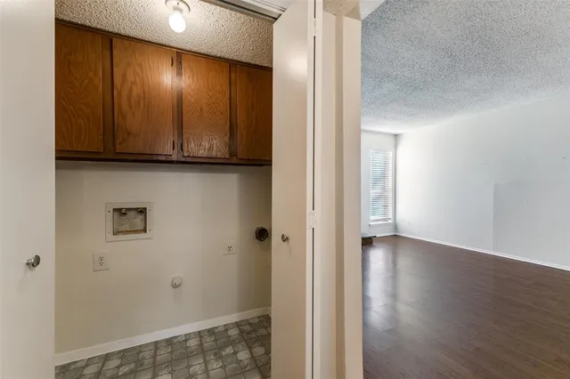 a view of hallway with wooden floor