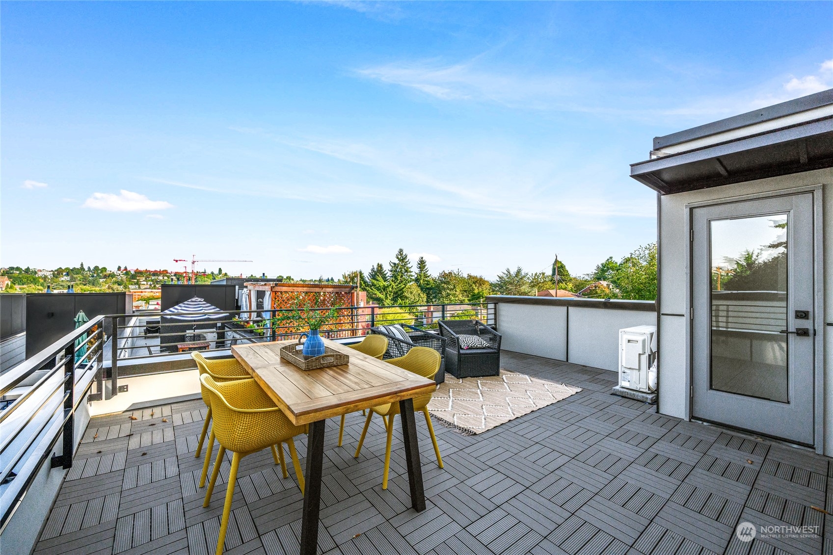 1621 South State Street Seattle, WA 98144 - Photo 1 of 23 a terrace with outdoor seating and city view