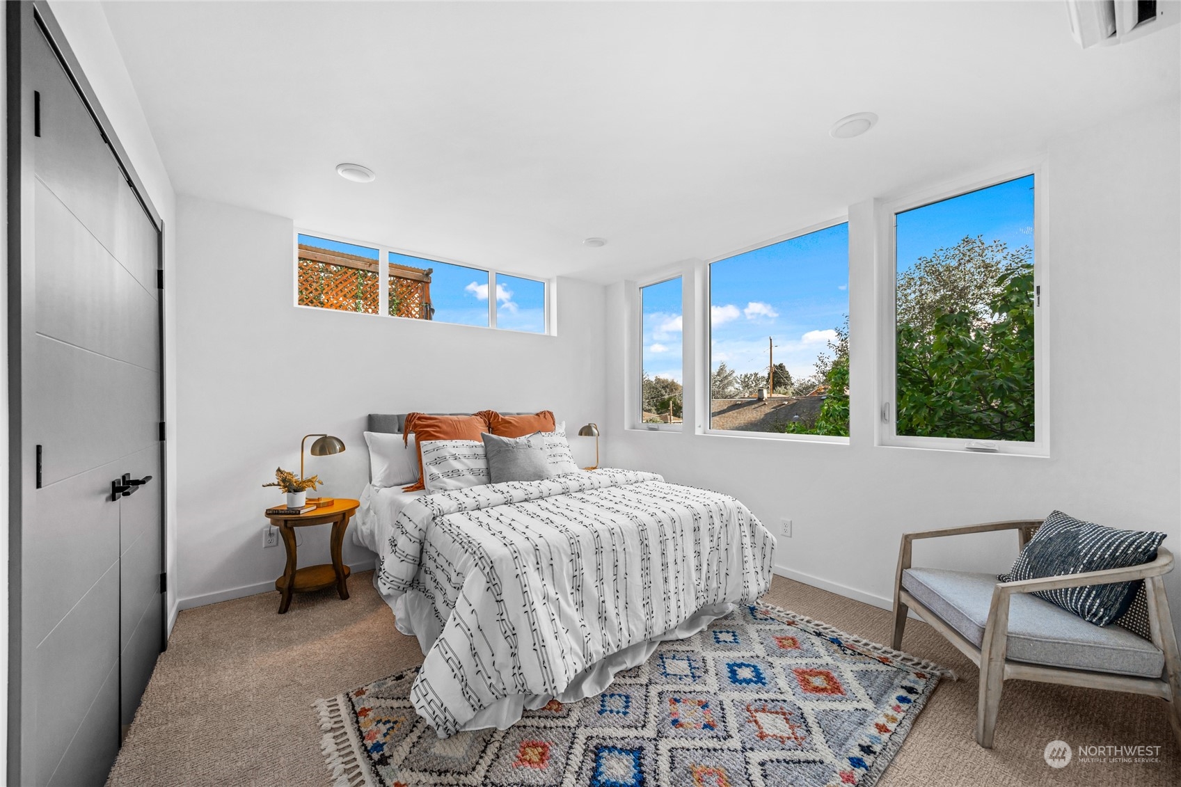 1621 South State Street Seattle, WA 98144 - Photo 15 of 23 a bedroom with a bed and wooden floor