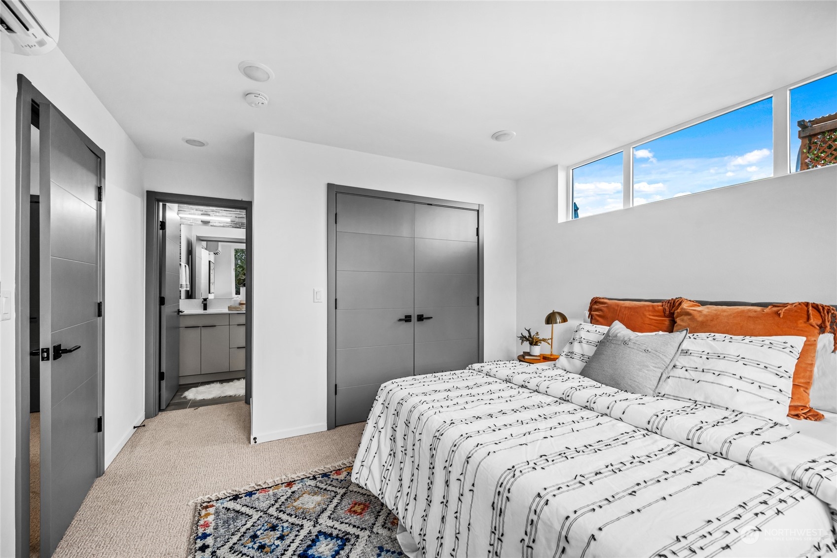 1621 South State Street Seattle, WA 98144 - Photo 17 of 23 a bedroom with a large bed and a chandelier