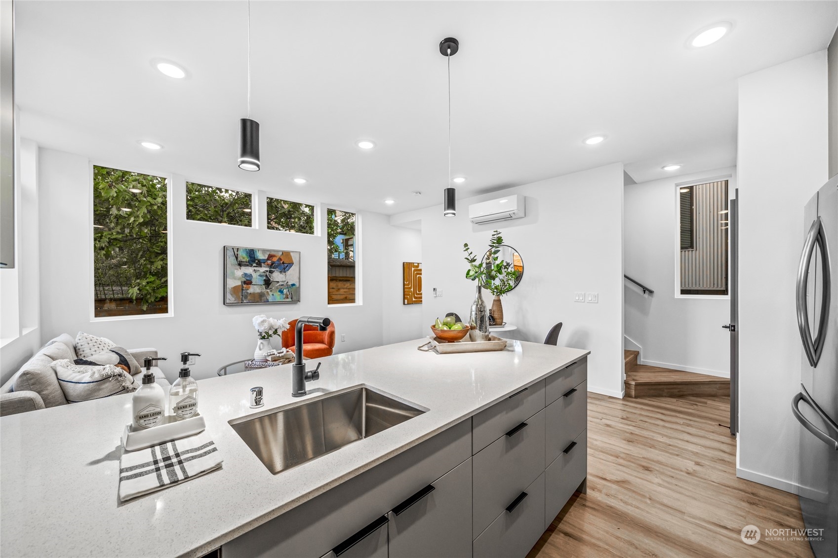 1621 South State Street Seattle, WA 98144 - Photo 10 of 23 a kitchen with a sink stove and wooden floor