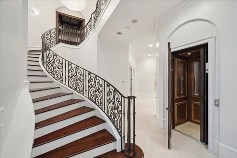 a view of entryway and hall with a front door