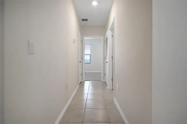 an empty room with closet area