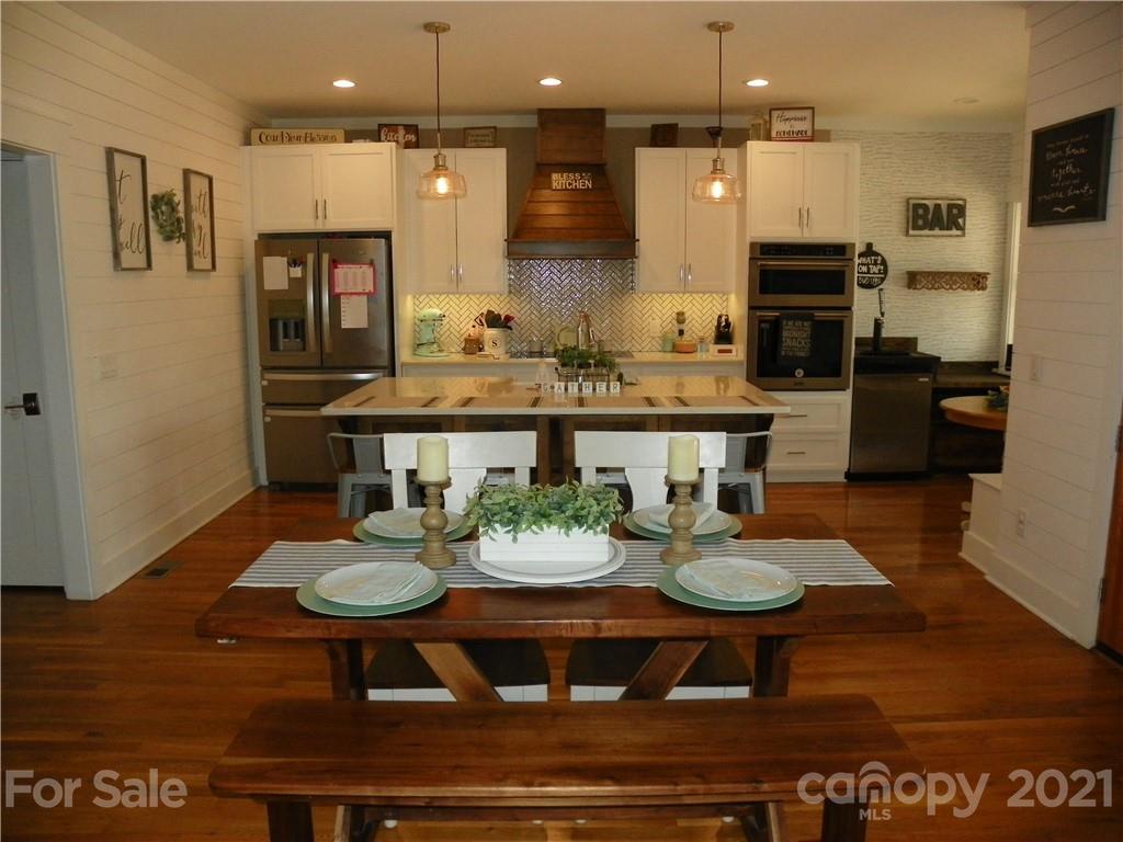 10617 Fink Road Mount Pleasant, NC 28124 - Photo 13 of 45 a view of a dining room with furniture