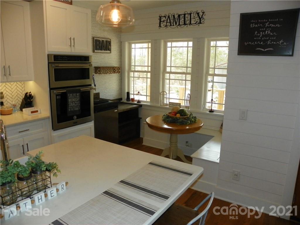 10617 Fink Road Mount Pleasant, NC 28124 - Photo 16 of 45 a kitchen with a refrigerator and a stove