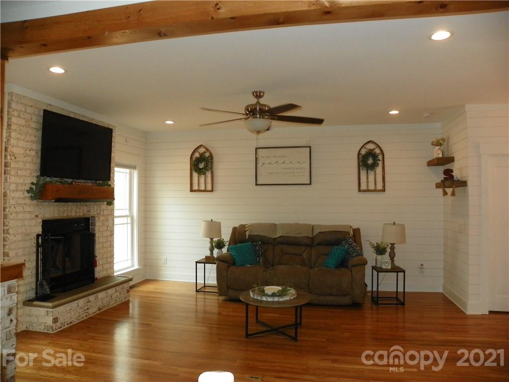 10617 Fink Road Mount Pleasant, NC 28124 - Photo 17 of 45 a living room with furniture and a fireplace