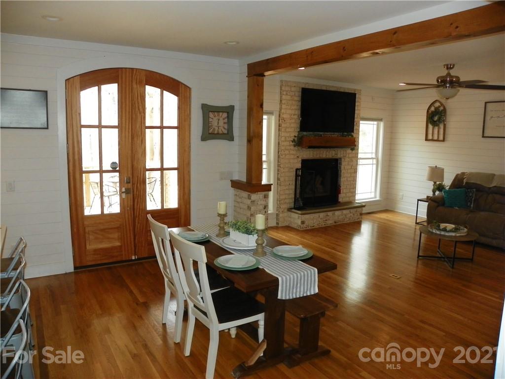 10617 Fink Road Mount Pleasant, NC 28124 - Photo 18 of 45 a dining room with furniture window and wooden floor