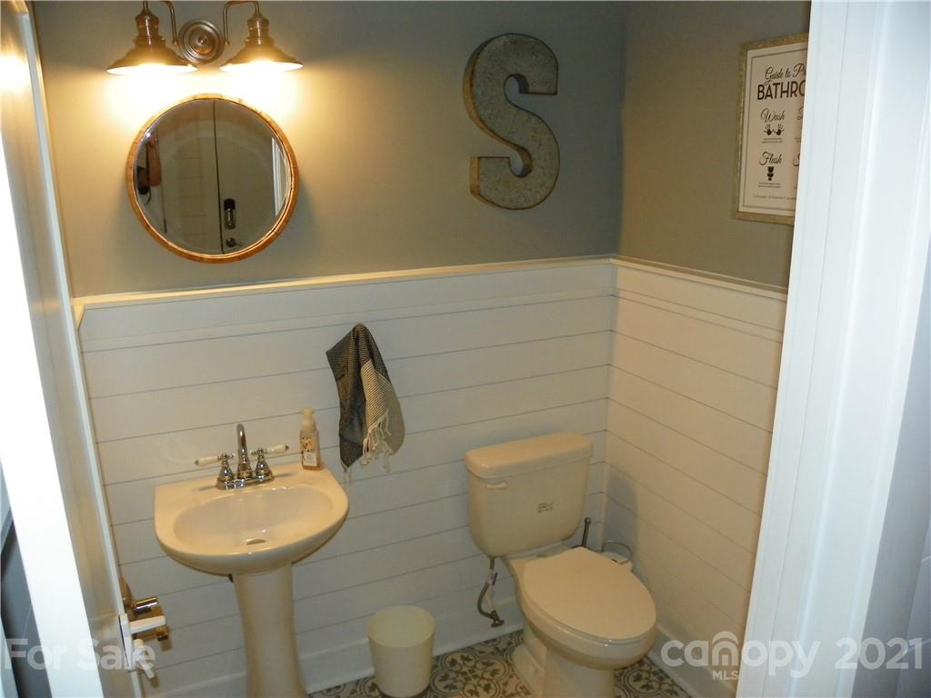 10617 Fink Road Mount Pleasant, NC 28124 - Photo 21 of 45 a bathroom with a toilet sink and mirror