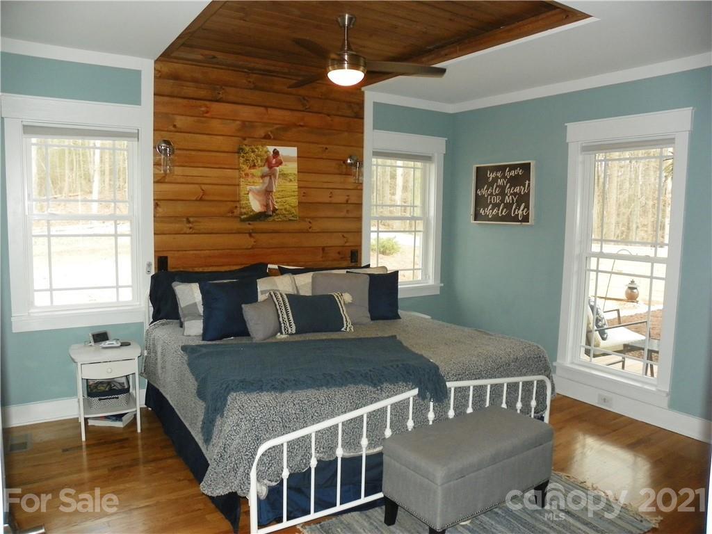 10617 Fink Road Mount Pleasant, NC 28124 - Photo 23 of 45 a bed sitting in a bedroom next to a window