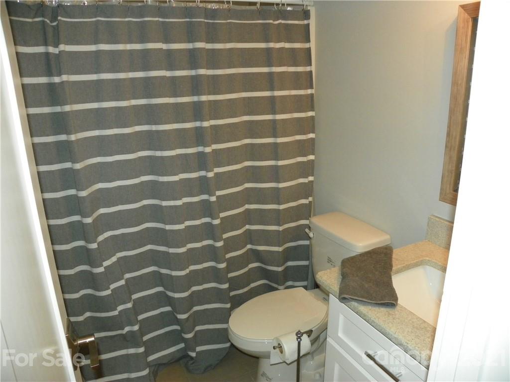 10617 Fink Road Mount Pleasant, NC 28124 - Photo 31 of 45 a bathroom with a toilet and a sink