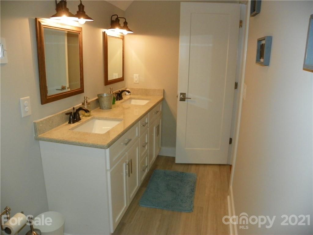 10617 Fink Road Mount Pleasant, NC 28124 - Photo 38 of 45 a bathroom with a double vanity sink and a mirror
