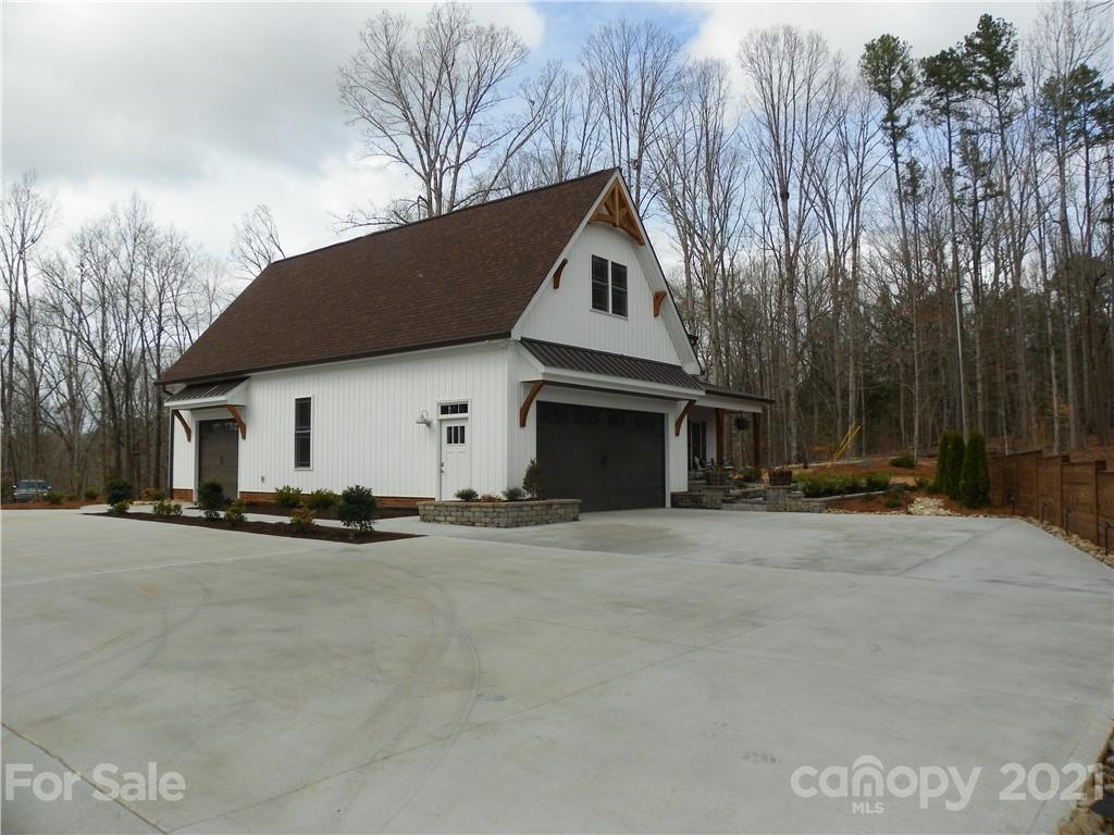 10617 Fink Road Mount Pleasant, NC 28124 - Photo 6 of 45 a front view of a house with a yard and garage