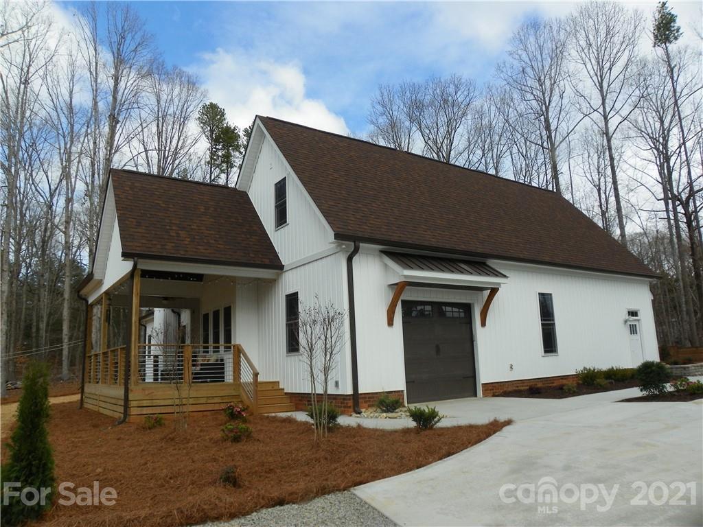 10617 Fink Road Mount Pleasant, NC 28124 - Photo 7 of 45 a front view of a house with garden