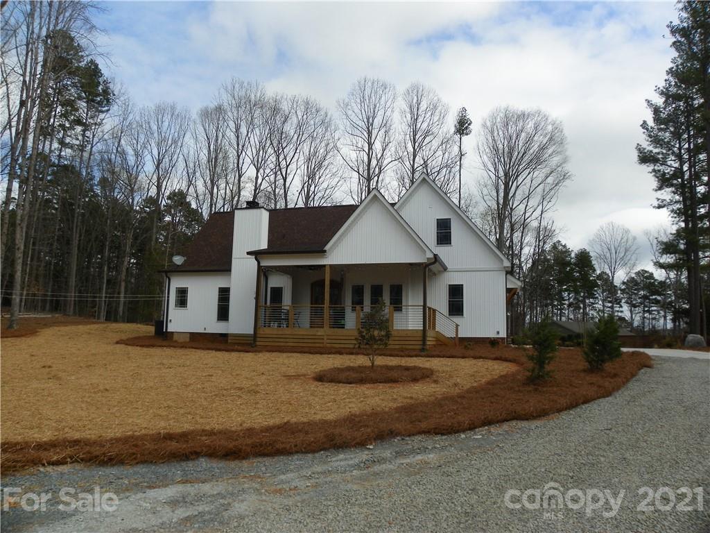 10617 Fink Road Mount Pleasant, NC 28124 - Photo 8 of 45 a front view of a house with a yard